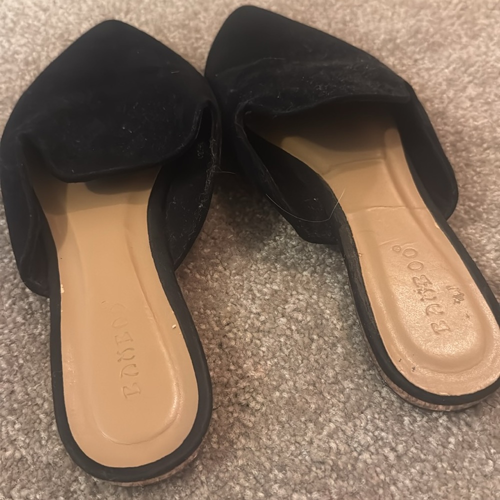 BAMBOO Black Suede Slides with gold trim at the heel
